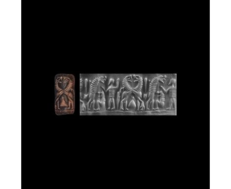 19th-18th century BC.&nbsp;A chert cylinder seal with two scenes that determine the picture: on the left a standing naked bea