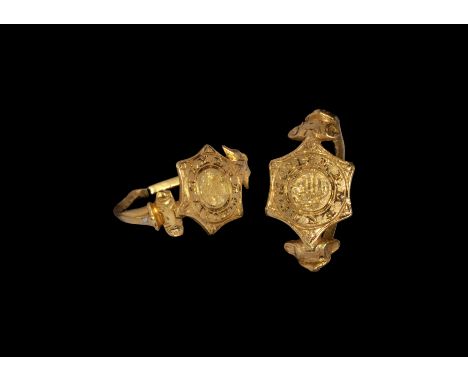 16th-early 17th century AD. A gold ring with thin hoop with expanding scrolled shoulders, traces of white and green enamel on