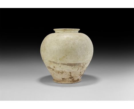 Tang Dynasty, 618-906 AD. A ceramic whiteware piriform jar with everted rim, slightly flared base.   4.1 kg, 30cm (11 3/4"). 