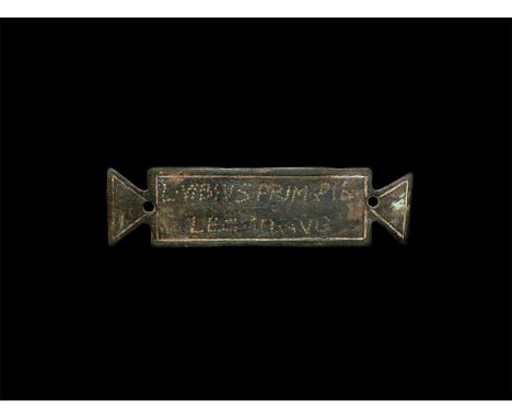 1st century AD. A military name plaque bearing an inscription 'L . VIBIVS . PRIM . PIL . / LEG . III . AVG' to one face trans