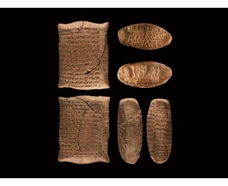 3rd millennium BC. A pillow-shaped ceramic tablet impressed to three sides with cuneiform script, one short side with a band 