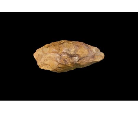 600,000-300,000 years BP. A knapped flint bifacial handaxe with partial remains of the cortex. 674 grams, 17cm (6 3/4"). Prop