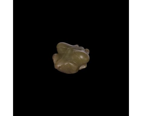 Song Dynasty, 13th century AD. A carved jade(?) figure of a frog modelled in the round.   38 grams, 40mm (1/2"). Property of 