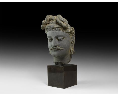 1st-4th century AD. A finely detailed carved schist head of Buddha with detailed carefully dressed hair, clean shaven with ne