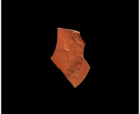 4th century AD.&nbsp;A fragment of a shallow dish depicting a finely modelled standing figuring wearing crested helmet, robes