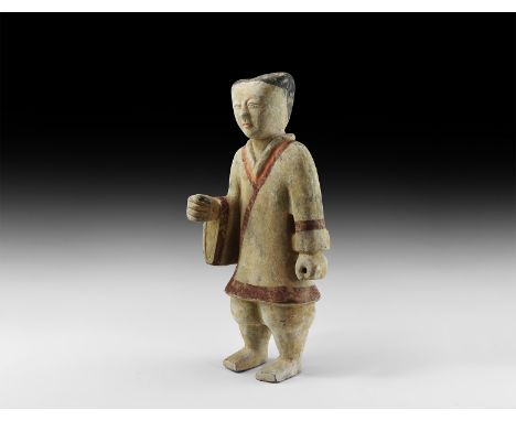 Han Dynasty, 206 BC-220 AD. A ceramic figurine of a standing warrior with cross-over tunic with red trims and wide sleeves, t