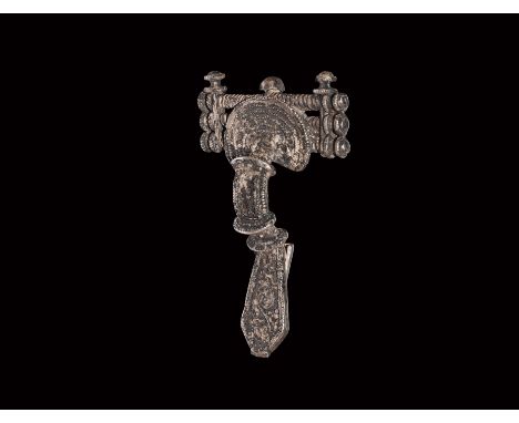 Chernyakhov Culture, 5th century AD. A silver bow brooch comprising a D-shaped headplate with concentric granulated bands, th