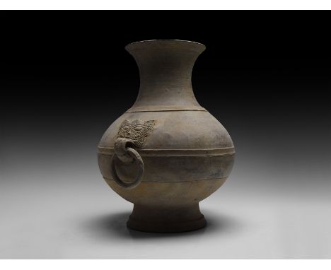 Han Dynasty, 206 BC-220 AD. A large ceramic bicolour vessel with pear-shaped bulbous body with flared base, tall neck with wi