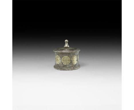 2nd-3rd century AD. A parcel-gilt silver pyxis with band of gilt discs to the sidewall depicting deities and their symbols (D