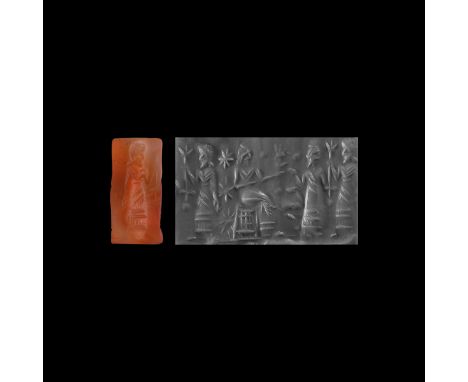 9th-6th century BC.&nbsp;A carnelian cylinder seal with bearded figure, wearing a fringed robe with a double v-shaped necklin