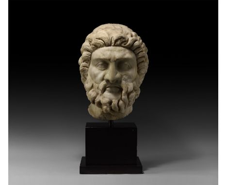 1st-2nd century AD. A monumental head of Asclepius or Jupiter (Greek Zeus), carved much larger than life-size in high quality