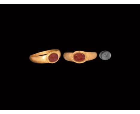2nd century AD. A carnelian intaglio of a leaping stag set in a slender D-section gold hoop with ellipsoid bezel. Cf. Chadour
