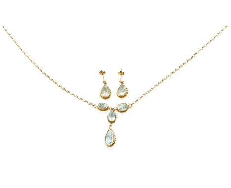 A 9 Carat Gold Blue Topaz Necklace, two oval cut blue topaz suspend a single oval cut blue topaz with a pear cut blue topaz d