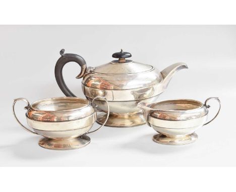 A Three-Piece George V Silver Tea-Service, by Joseph Gloster Ltd., Birmingham, 1935, each piece oval and on spreading foot, c