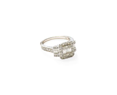 A 14 Carat White Gold Diamond Cluster Ring, composed of round brilliant cut and baguette cut diamonds, in claw settings, to a