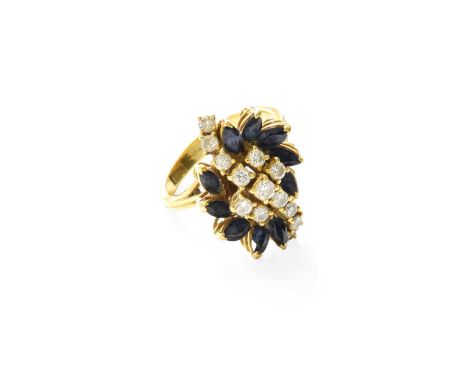 An 18 Carat Gold Sapphire and Diamond Cluster Ring, a diagonal row of round brilliant cut diamonds flanked by marquise cut sa