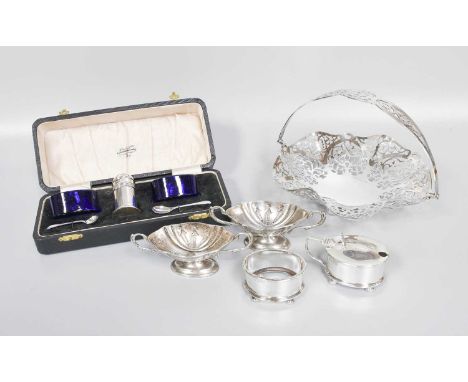 A Collection of Assorted Silver, including a pierced silver basket on ball feet and with overhead handle; a cased condiment-s