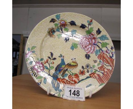 A Spode hand painted plate decorated with birds.  20 cm diameter.