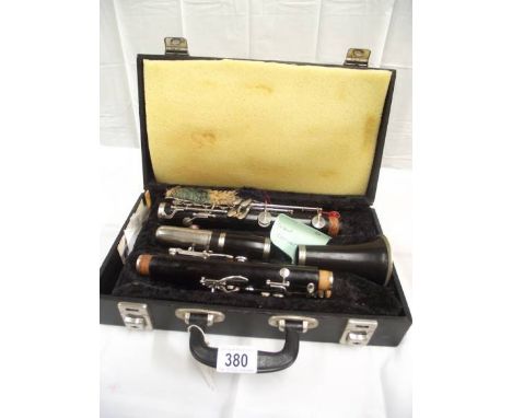 A cased clarinet, marked 9046