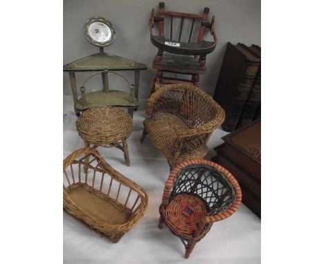 A quantity of vintage wicker and wood doll's furniture.