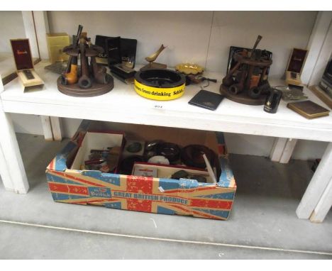 A good collection of smoking and tobacco related items including 2 pipe racks, pipes, advertising ware etc.