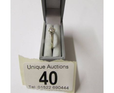 A diamond single stone 0.25ct ring in a 9ct gold shank, size K half.