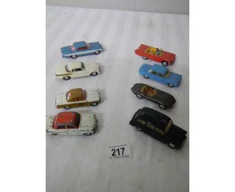 8 Corgi toys including Ford, Triumph, Jaguar etc.,