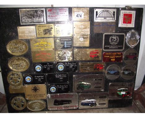 A display board of 1980s steam and vintage rally plaques