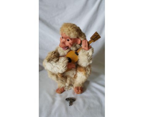 A Roullet & Decamps Monkey Automaton Guitarist in working order with R & D key (please note R & D key does not win monkey but