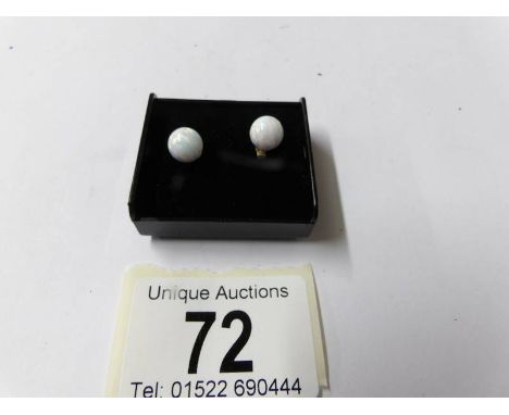A pair of 9ct gold and opal earrings.
