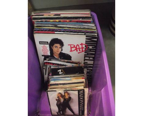A mixed lot of LP and 45 rpm records including Michael Jackson, Madonna etc.,