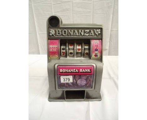 A vintage miniature Toy Bonanza Bank 1 arm bandit with metal front. i.w.o. 29cm tall at highest point.