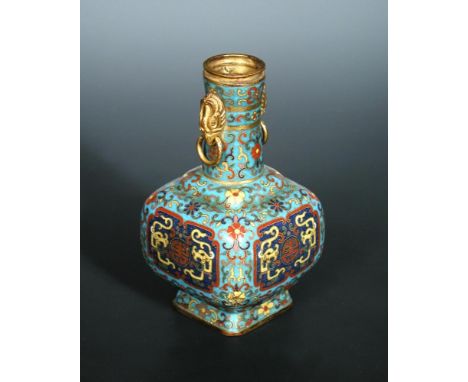 A turquoise ground cloisonne bottle, four character mark of Qianlong, the cylindrical neck applied with gilt copper eagle mas