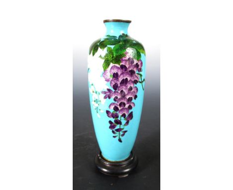 An early 20th century turquoise ground cloisonne vase, one side of the slender ovoid body worked with wisteria blooms , 25cm 