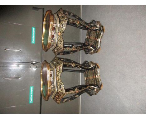 A pair of black lacquer vase stands painted in colours and gilt with lotus, the shaped hexagonal tops above aprons pierced wi