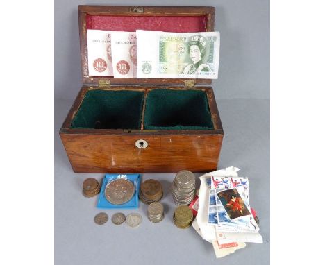 An early to mid-19th century rosewood two-division tea caddy (now converted) and its contents to include various British stam