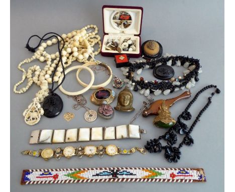 A good selection of jewellery to include Whitby jet, a Chinese heavy silver pendant mounted with a jade ring, a 19th century 