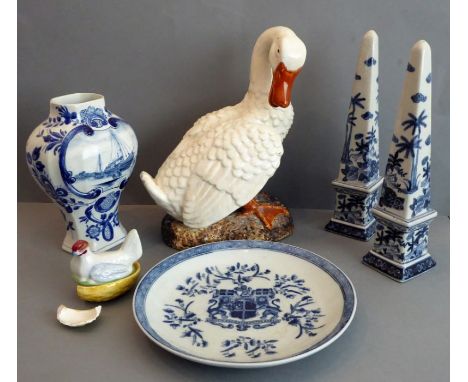Five pieces comprising an East India Company armorial plate, an 18th-century-style Delft pottery vase (minus lid), a pair of 