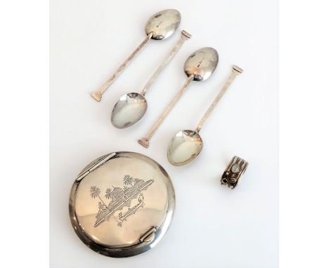 Silver items to include a set of four hallmarked silver coffee spoons, an early 20th century Eastern white-metal compact and 