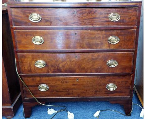 An early 19th century mahogany caddy top chest; boxwood-strung top above four full-width graduated drawers and raised on high