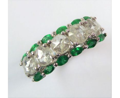An 18-carat white-gold, emerald and diamond ring; ring size L