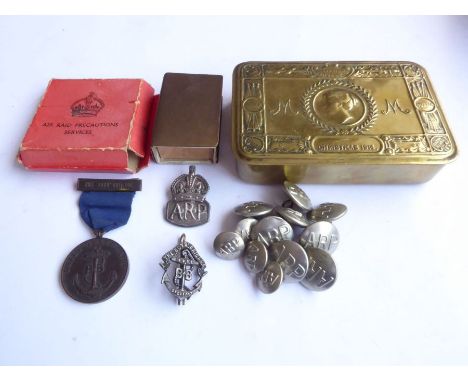 A Princess Mary Gift Box and its contents: a silver Air Raid Precautions badge and a set of ARP buttons (8 large and 4 small)