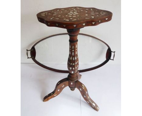 A early/mid 20th century mother of pearl inlaid Eastern tripod occasional table together with an Edwardian oval mahogany fram