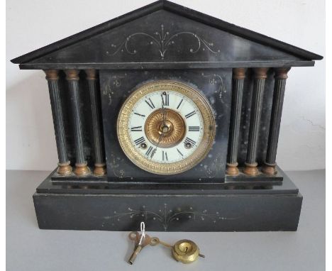 A large late 19th century black slate eight-day mantle clock; the gilded movement signed 'Ansonia, New York' and striking on 