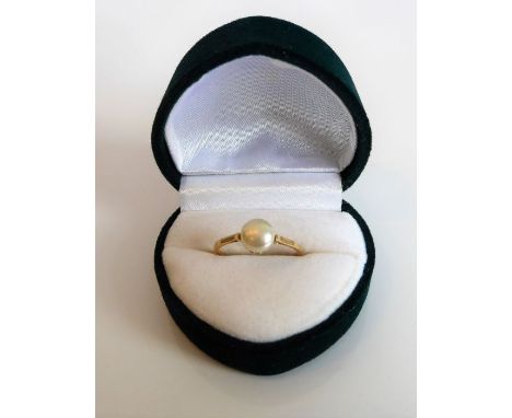 A lady's yellow-gold dress ring (unmarked); centrally set with a single pearl, ring size L, within a heart-shaped presentatio