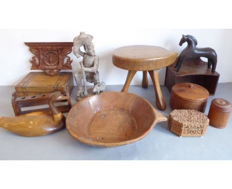 A good selection of various treen to include handcrafted bowls, a tripod stool, a carved duck, wall hanging wooden shelves/po