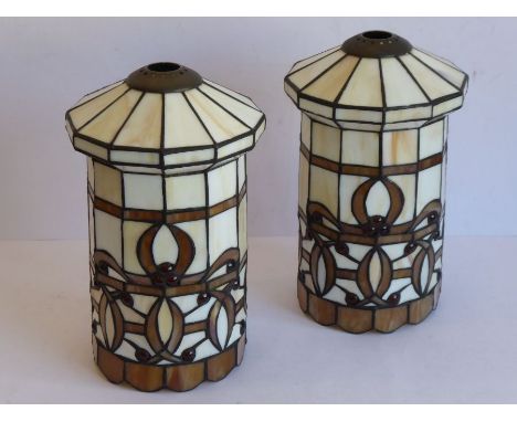 A pair of Tiffany- style glass light shades of dodecagon form; cream opaque and light-coffee-coloured shaped glass panels, bo