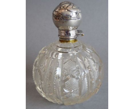 A Chinese silver-topped cut-glass perfume flask; the silver top with embossed dragon, marked for Tuck Change &amp; Co., Shang