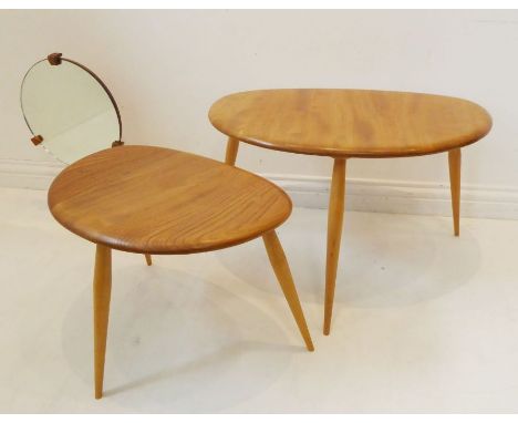 Two Ercol-style elm-topped shaped occasional tables together with an Ercol-style mirror having turned circular elm base (the 