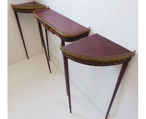A French-style reproduction&nbsp;three-piece console table set; mahogany and gilt-metal-mounted, comprising a single rectangu